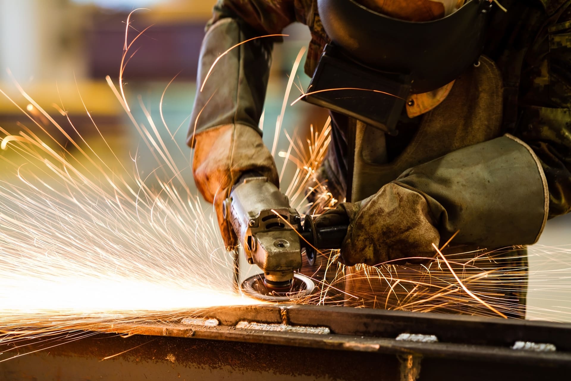 Electric,Wheel,Grinding,On,Steel,Structure,In,Factory